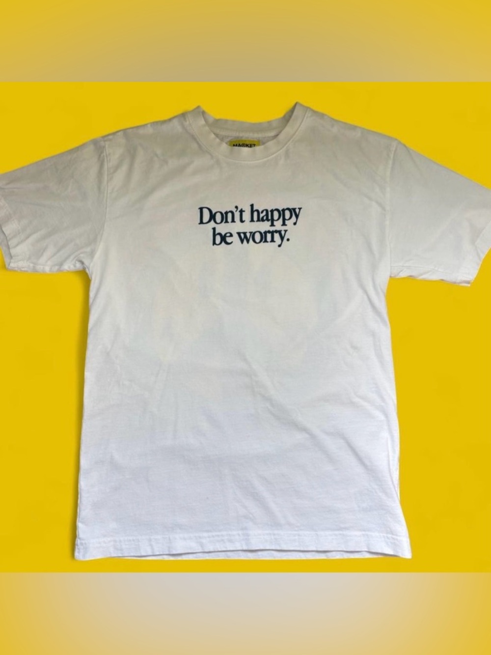 Funny graphic tee with smiley face on the back